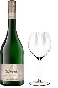 Eine Flasche Geldermann Jahrgangssekt 2016 steht neben einem eleganten Weinglas, bereit zum Servieren.