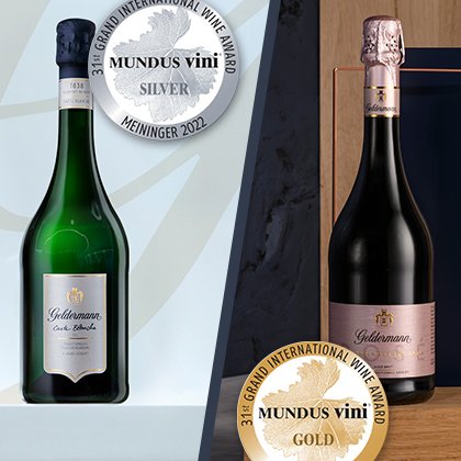 Zwei Flaschen Sekt von Goldemann, eine grüne und eine rosafarbene, mit Gold- und Silbermedaillen für internationale Auszeichnungen.