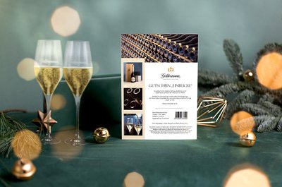 Weihnachtsgeschenk-Ideen: Gutschein zum Ausdrucken für Führungen in Breisach mit zwei Gläsern Geldermann Sekt vor weihnachtlichem Hintergrund